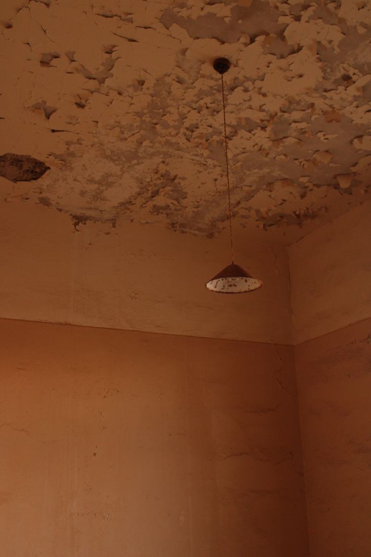 Water damage restoration in a Las Vegas home showing a water-stained, sagging ceiling